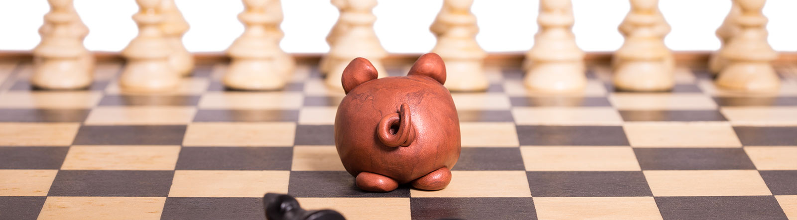 Piggy bank on chess board.